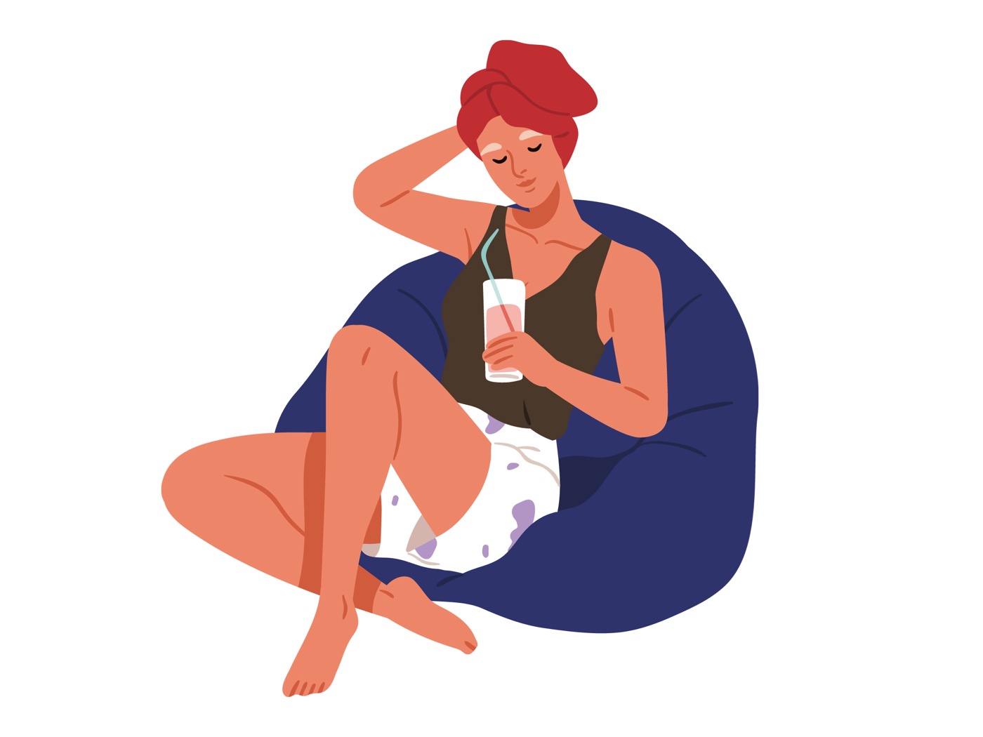 Eine Frau relaxt mit einem Getränk auf einem Sitzsack.