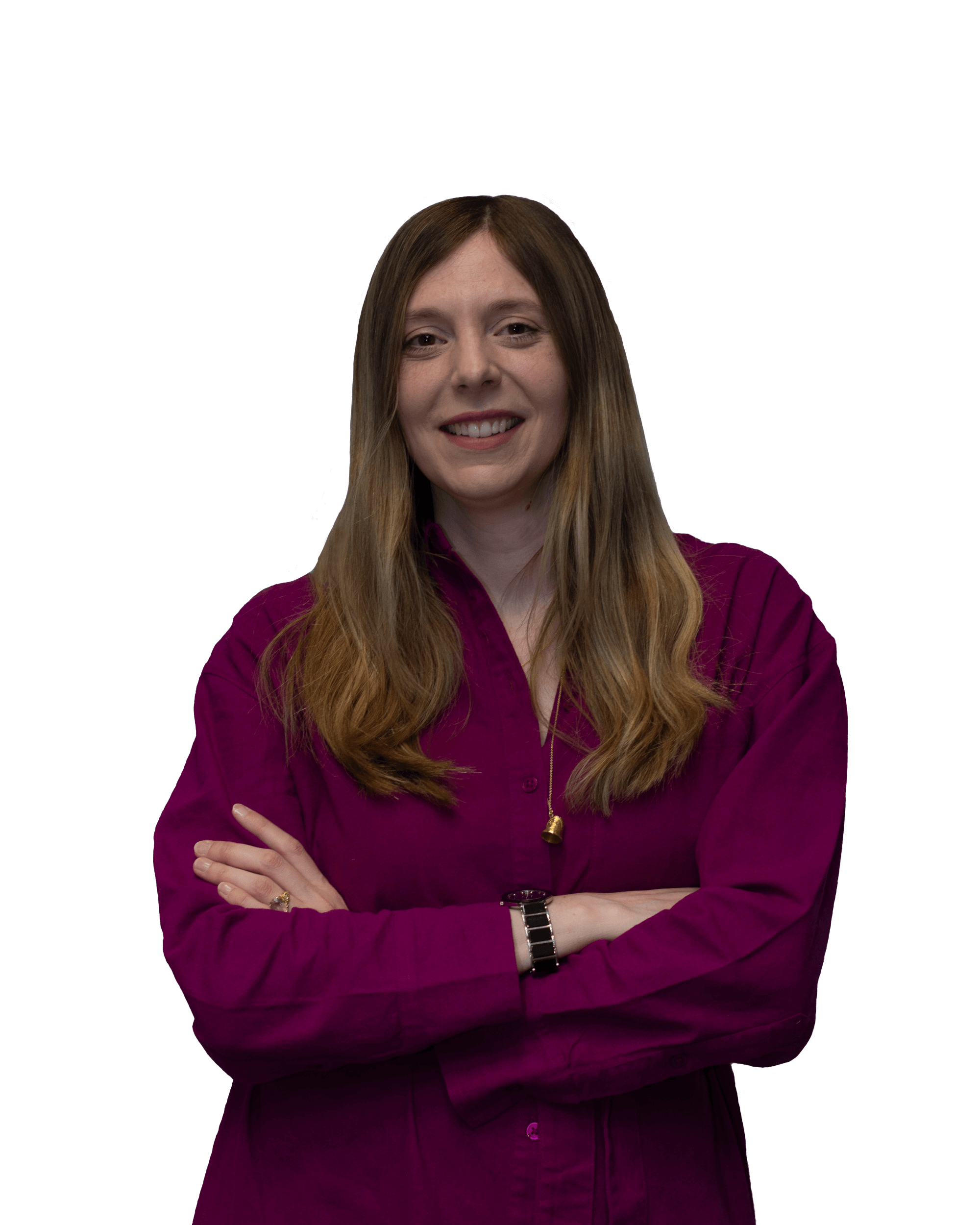 Smiling woman with long brown hair wearing a magenta button-up shirt with arms crossed.