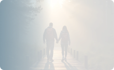 Man and woman holding hands and crossing the bridge