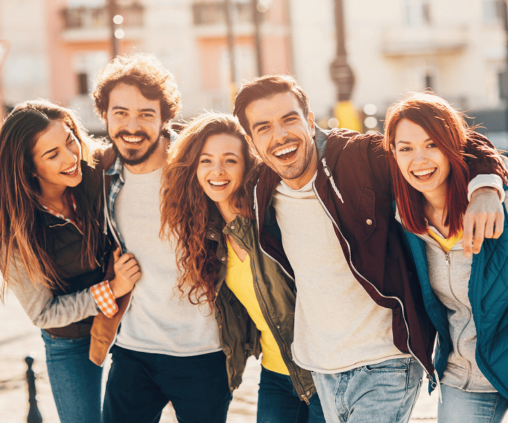 Smiling group of friends hugging