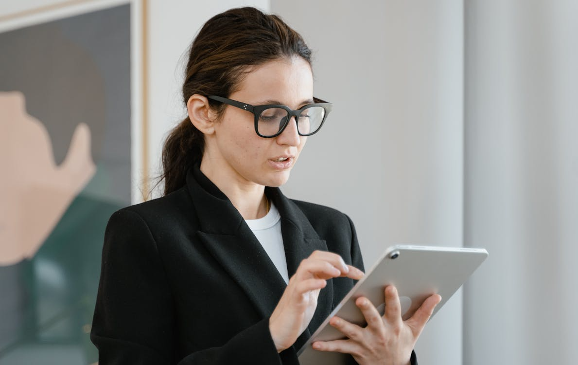 a woman using a tablet indoors 