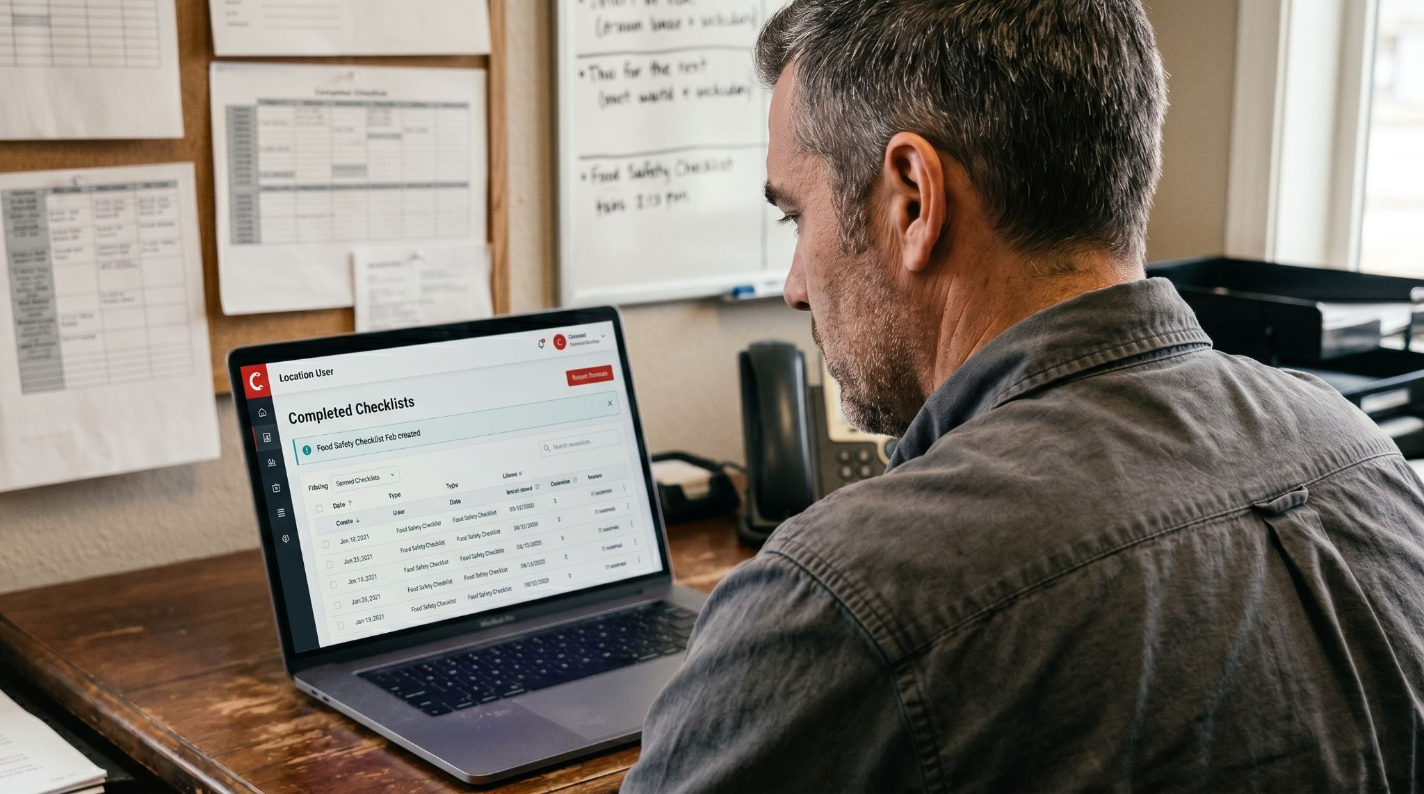 restaurant manager reviewing AI-generated food safety compliance report