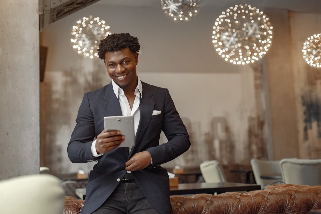 restaurant manager reviewing tablet data