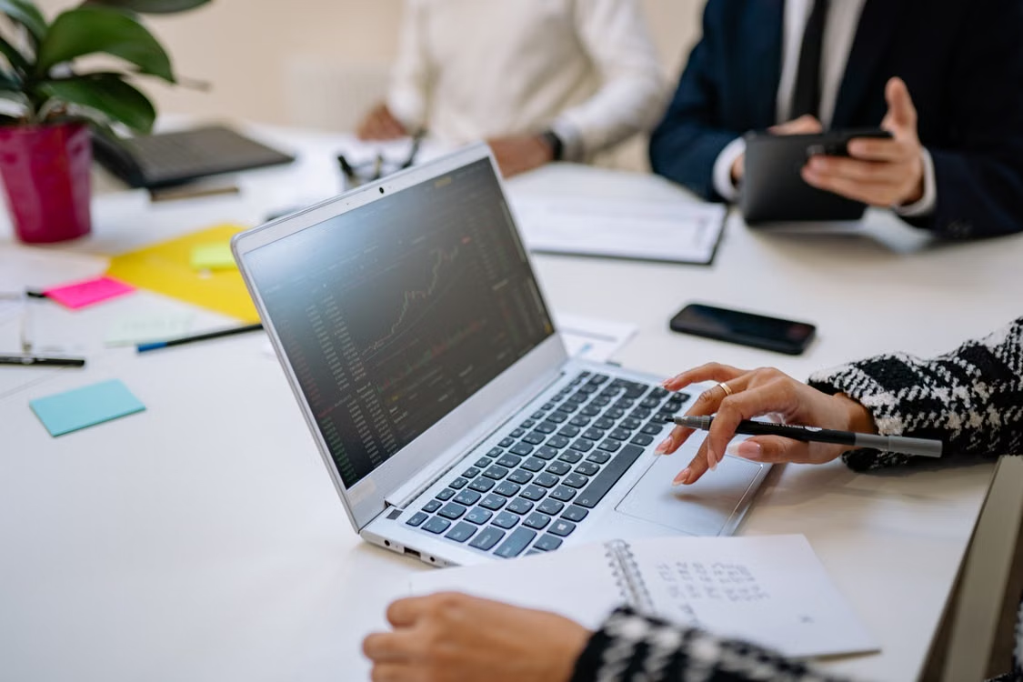 using laptop in a business meeting 