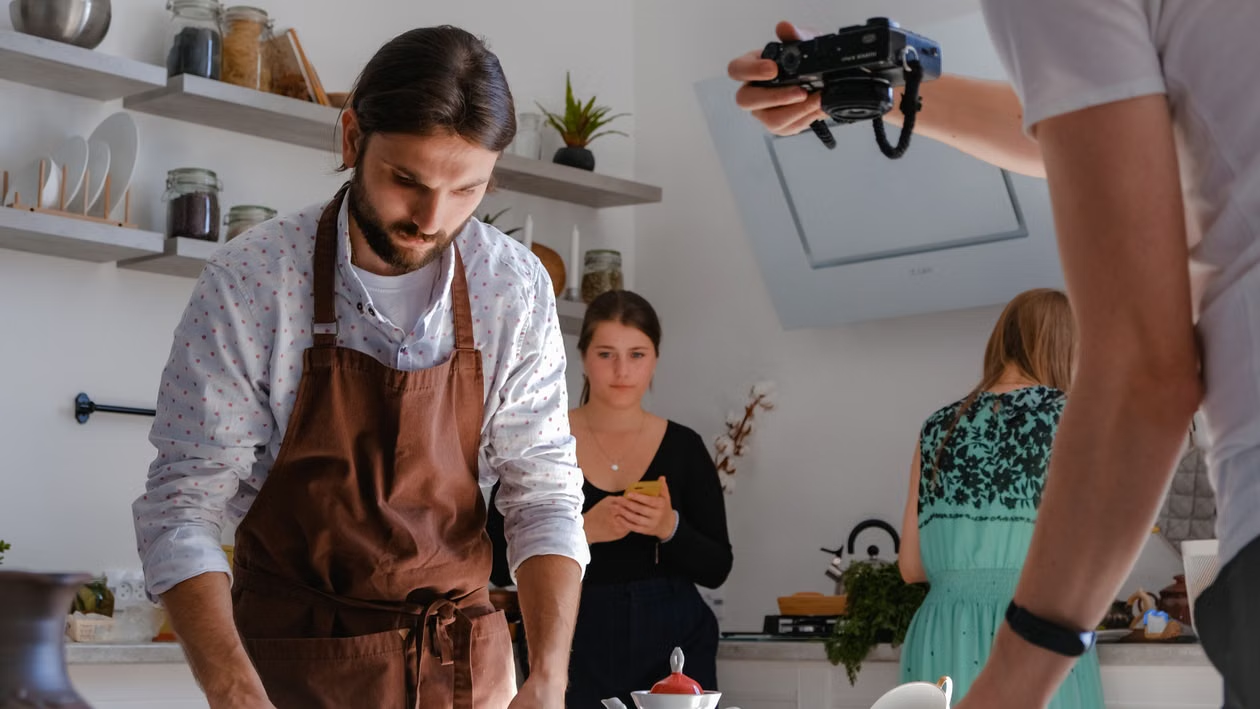 Employee photographs food quality standards