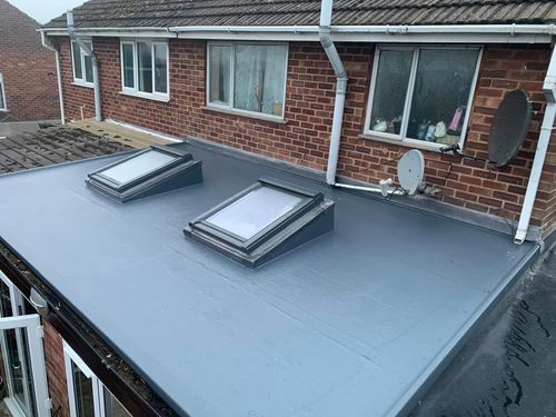 new fkat roof installation with skylights