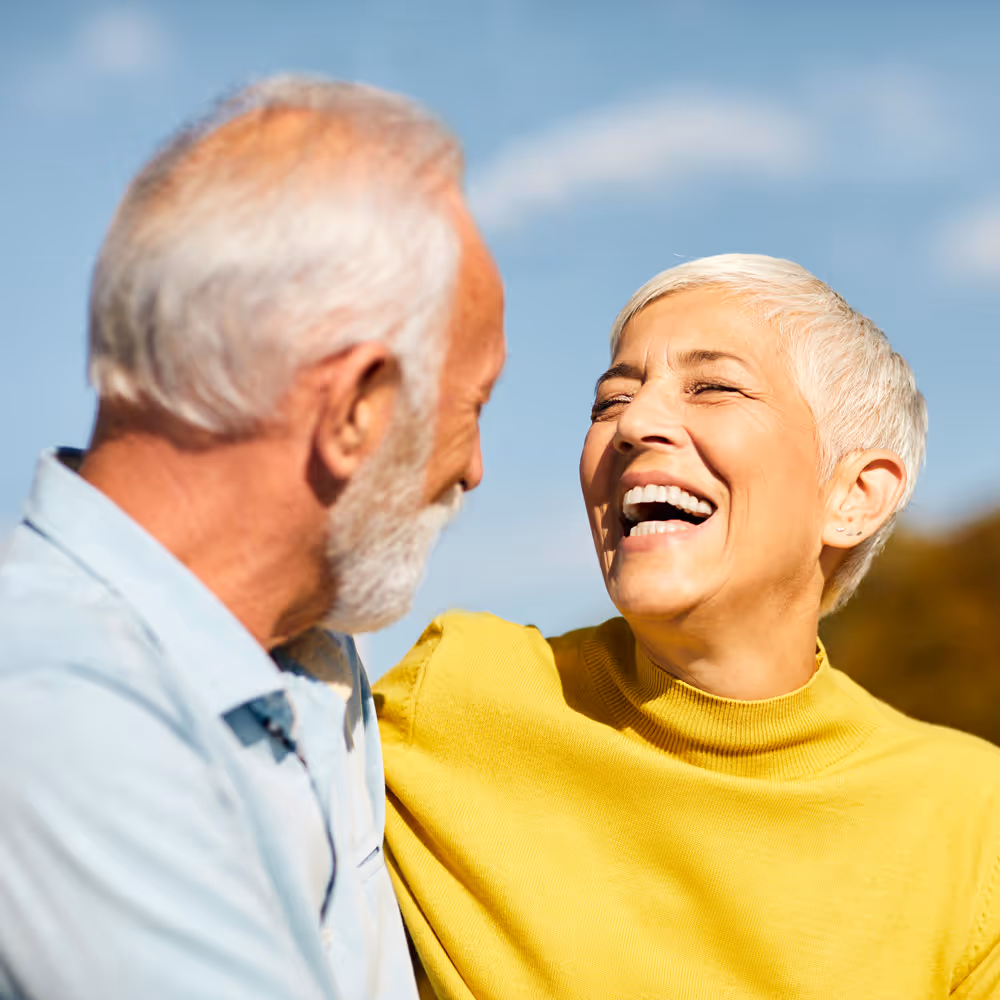 old couple laughing outside