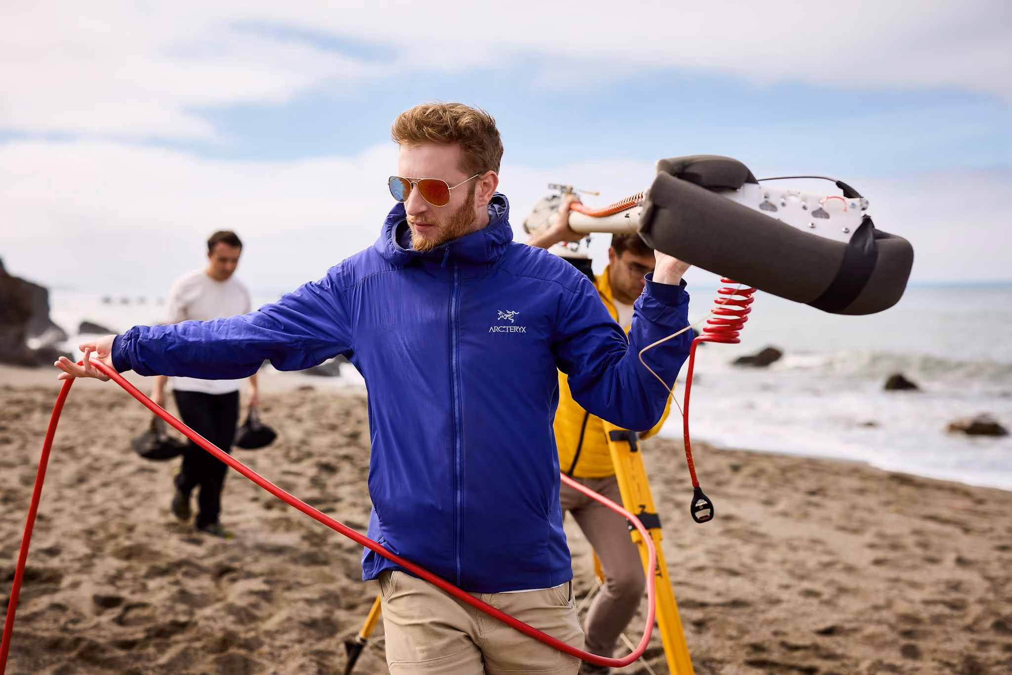 Engineers holding balloon launch hardware