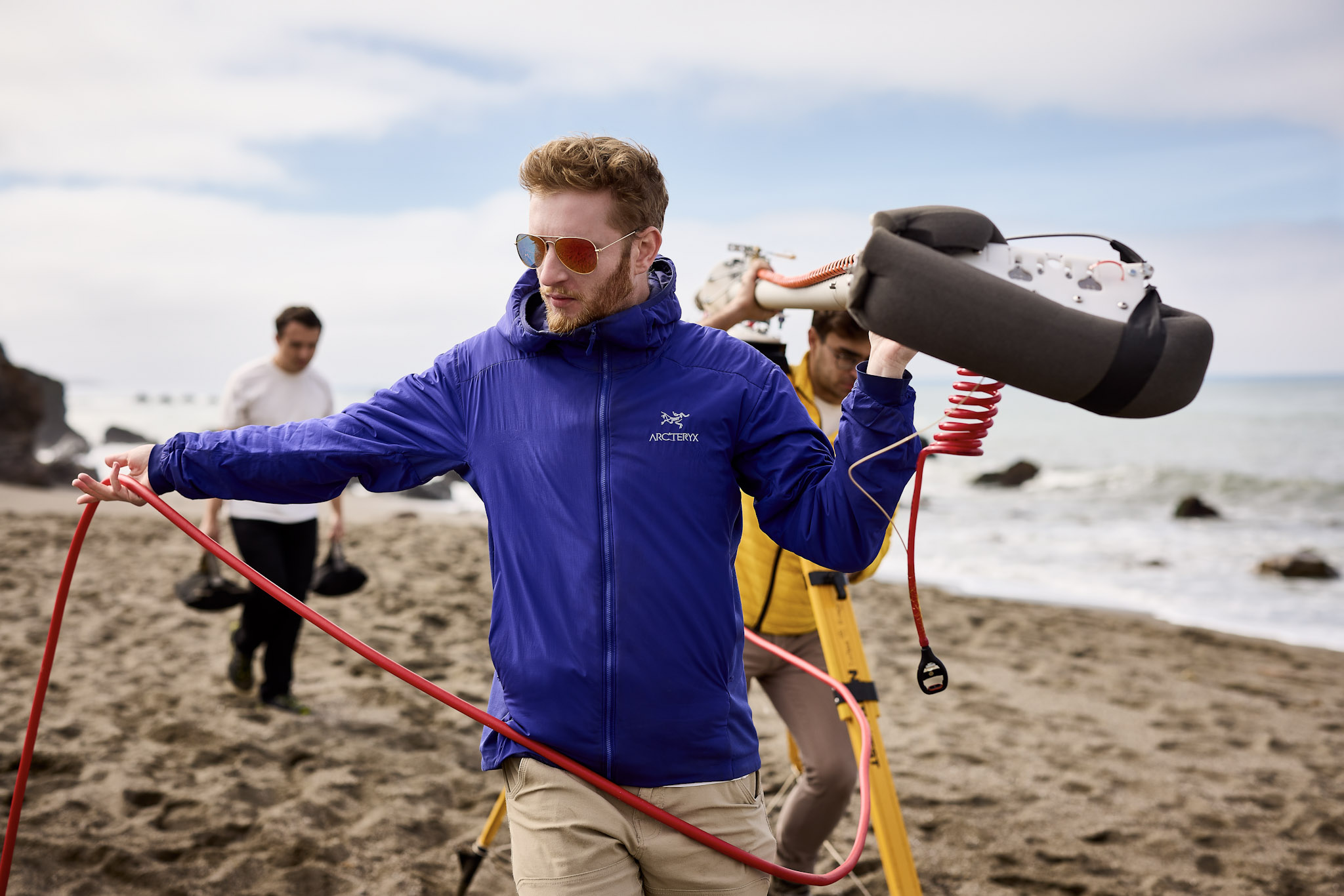 Engineers holding balloon launch hardware