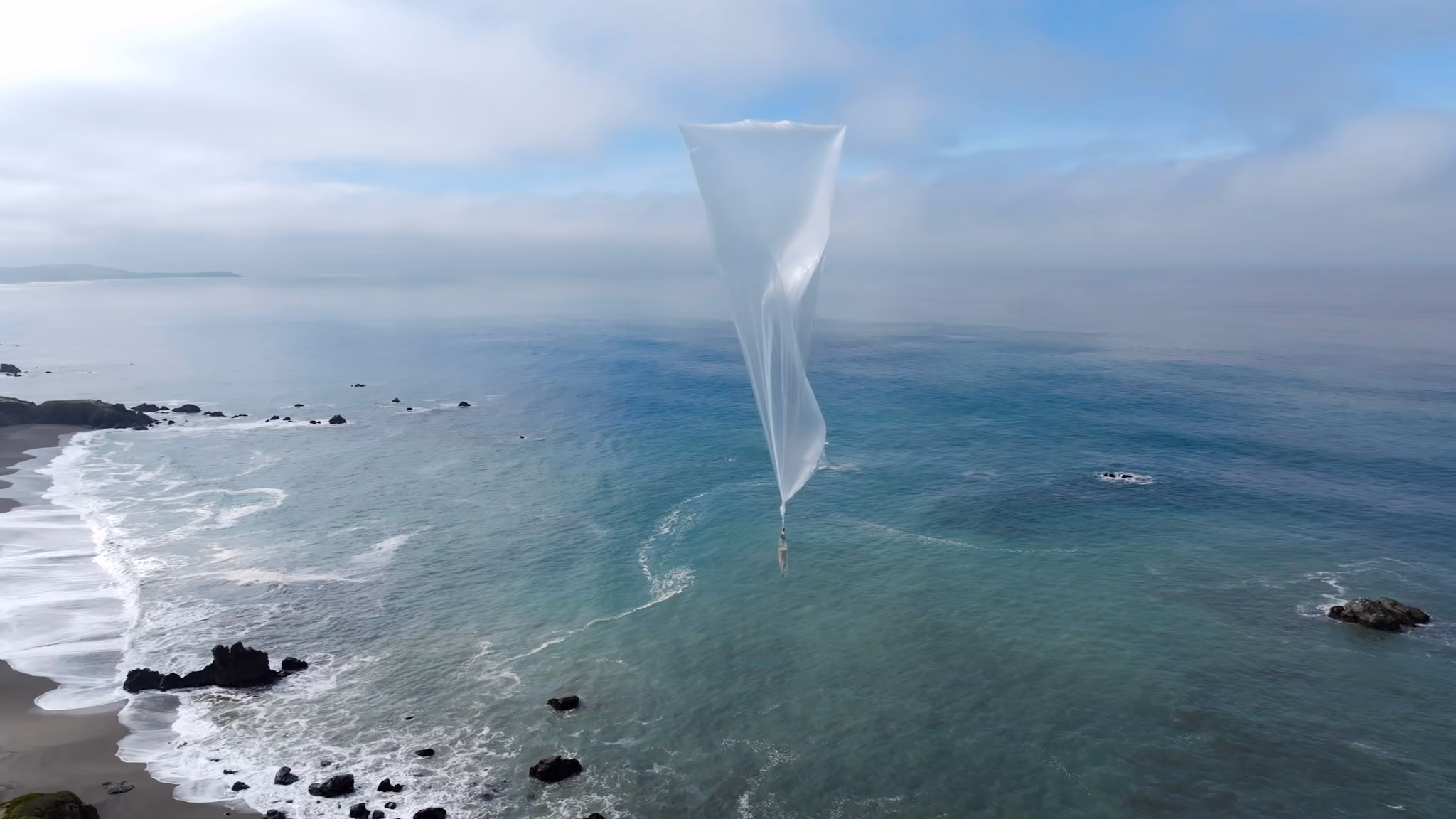 Weather balloon flying across the ocean
