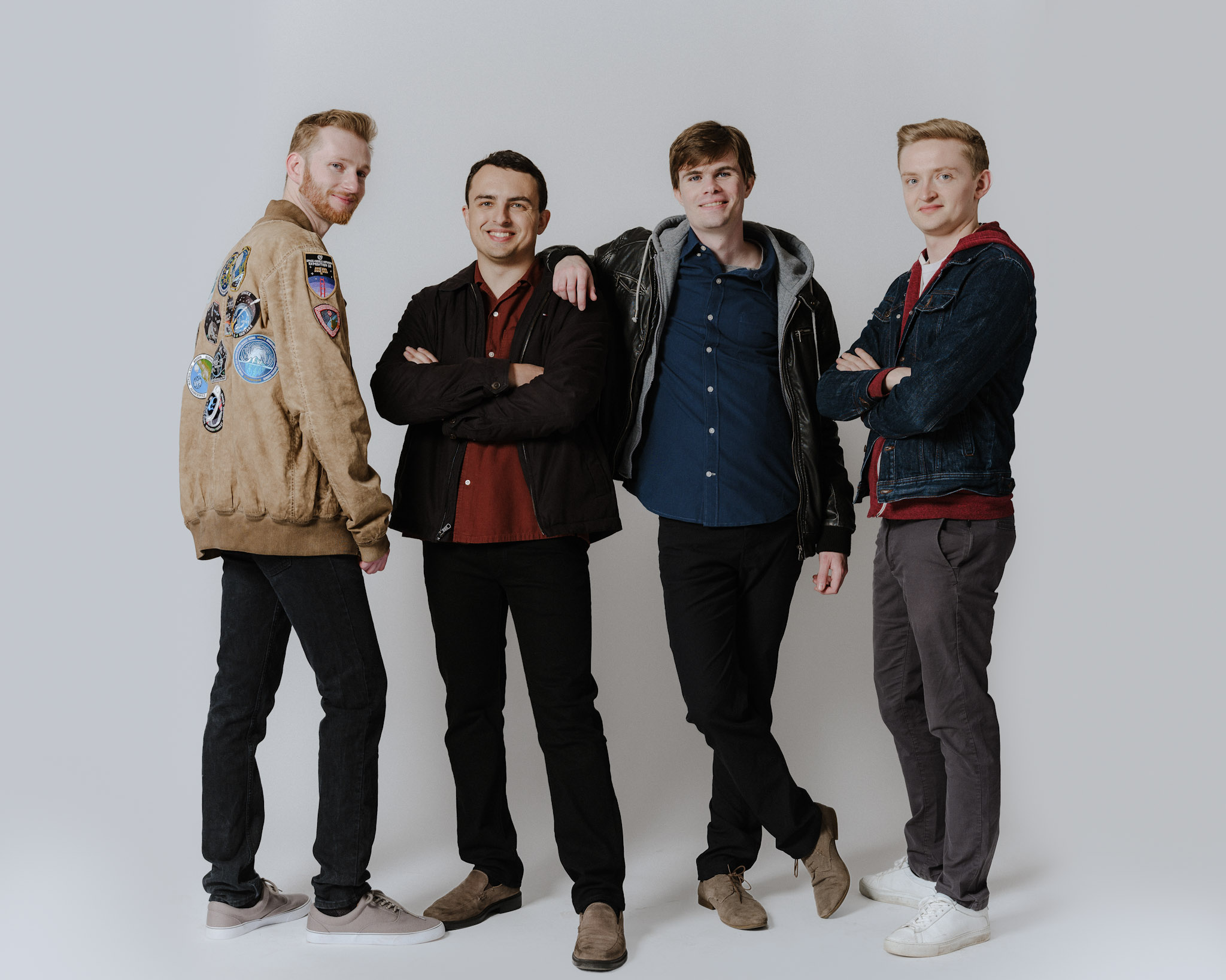 Group photo of four WindBorne co-founders in casual clothes