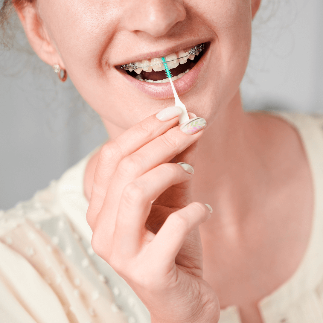 a woman brushing her teeth
