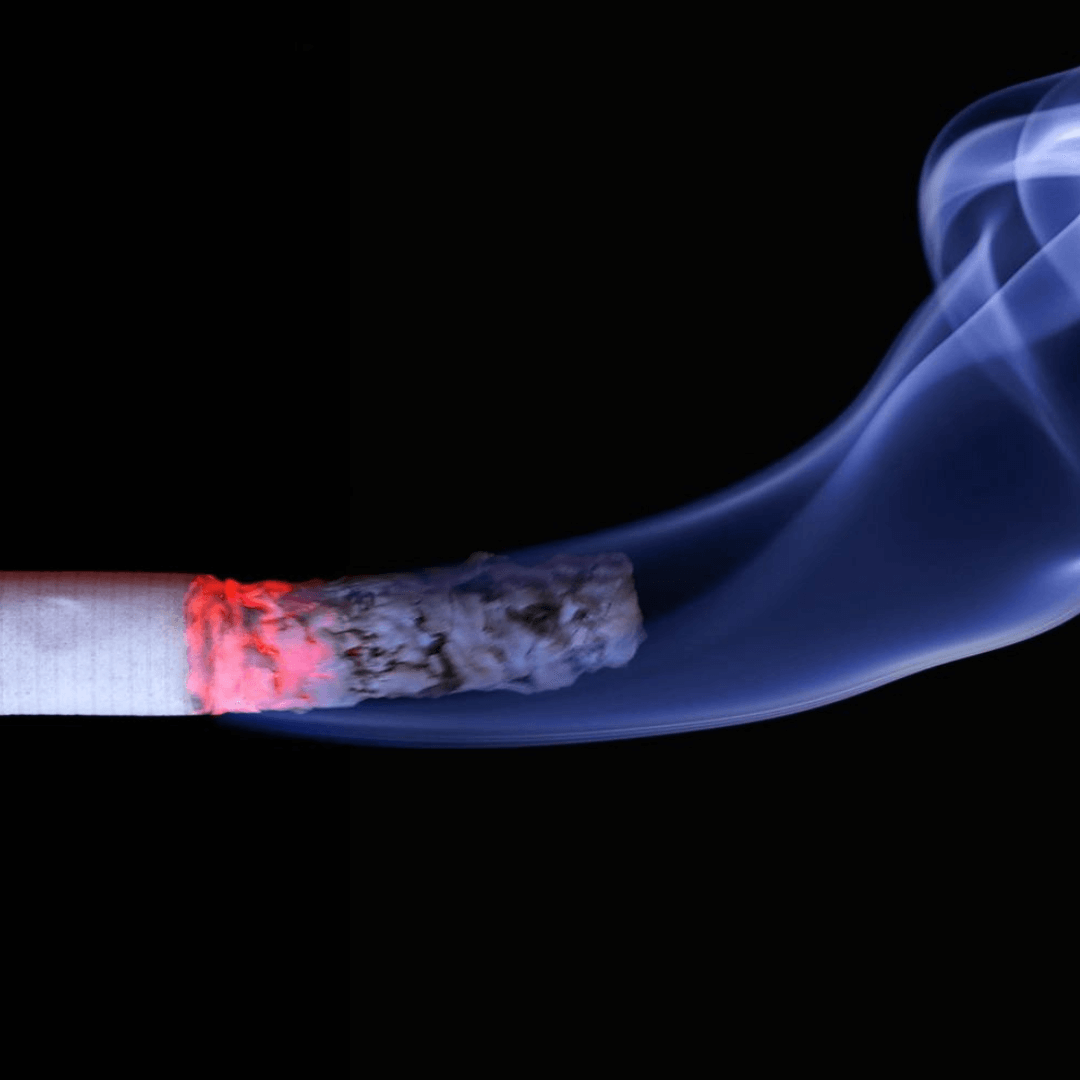 a cigarette with smoke coming out of it