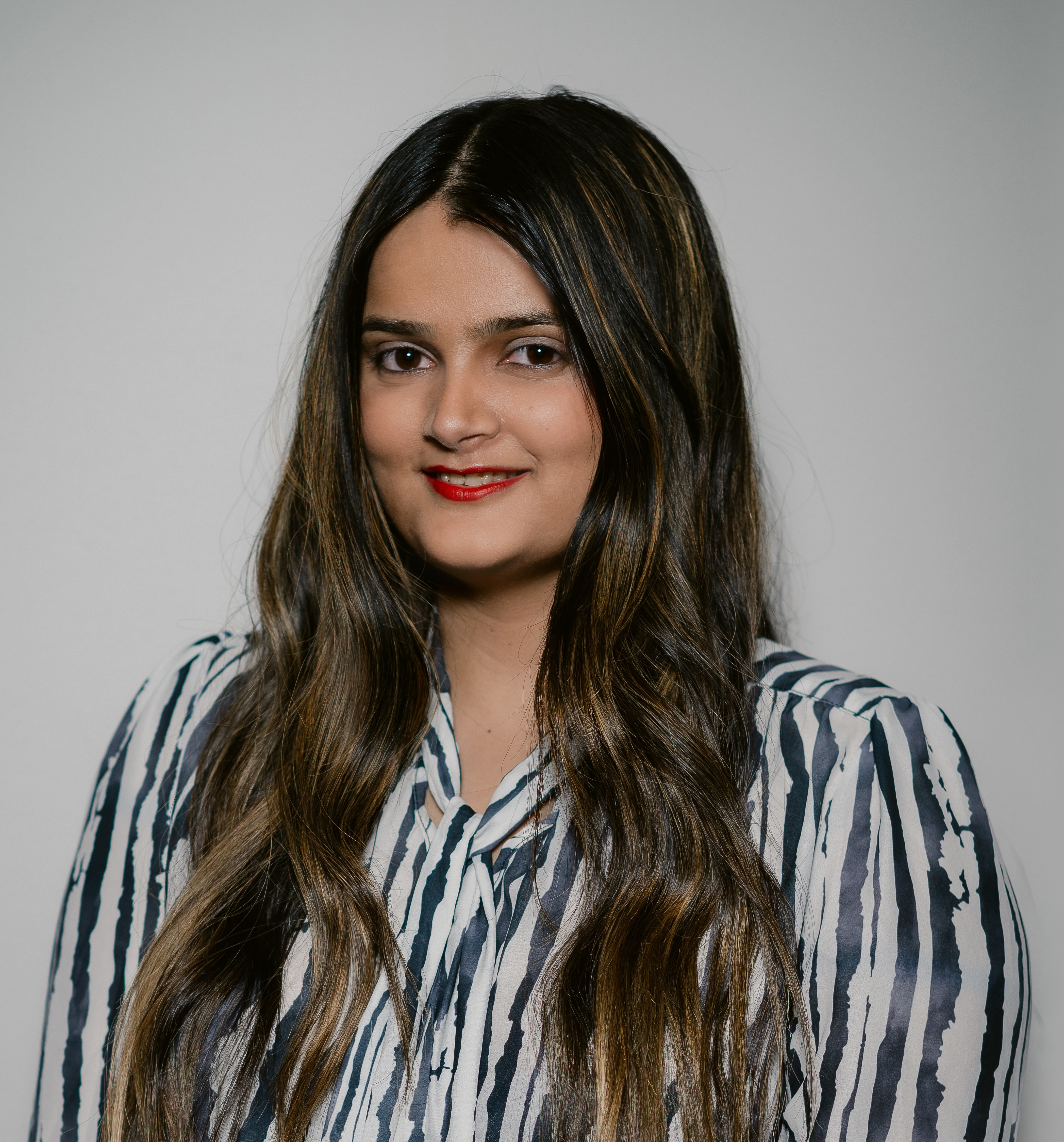A headshot photo of a Handl Health founding team member.
