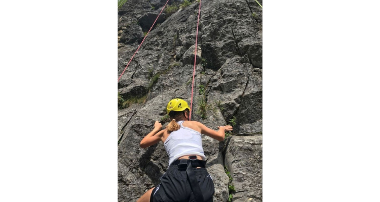 woman rock climbing as a hobby