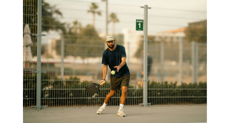man playing pickleball as a hobby