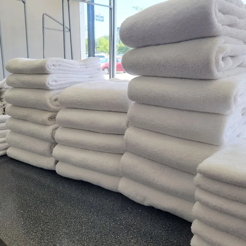 Stacks of freshly washed and folded white towels