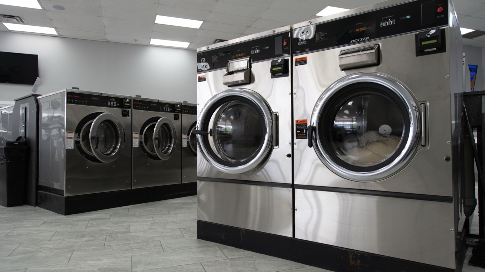 Large commercial washers ready for the next load