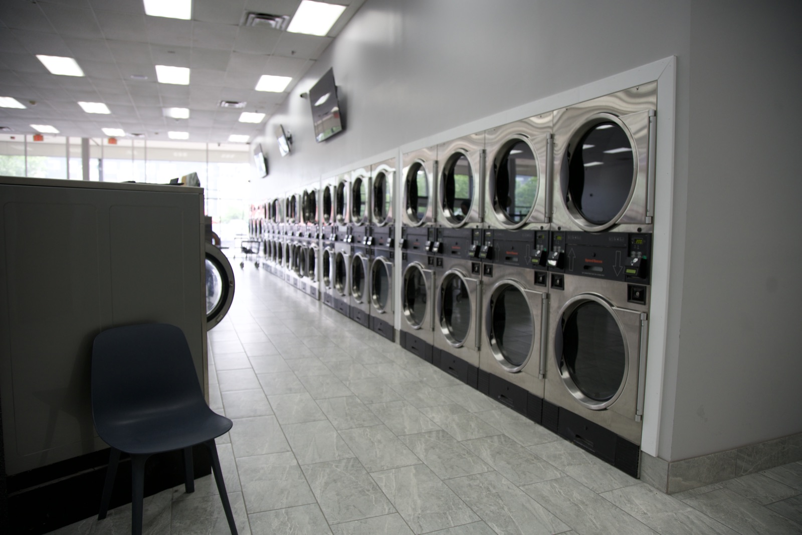 Long row of stacked commercial dryers