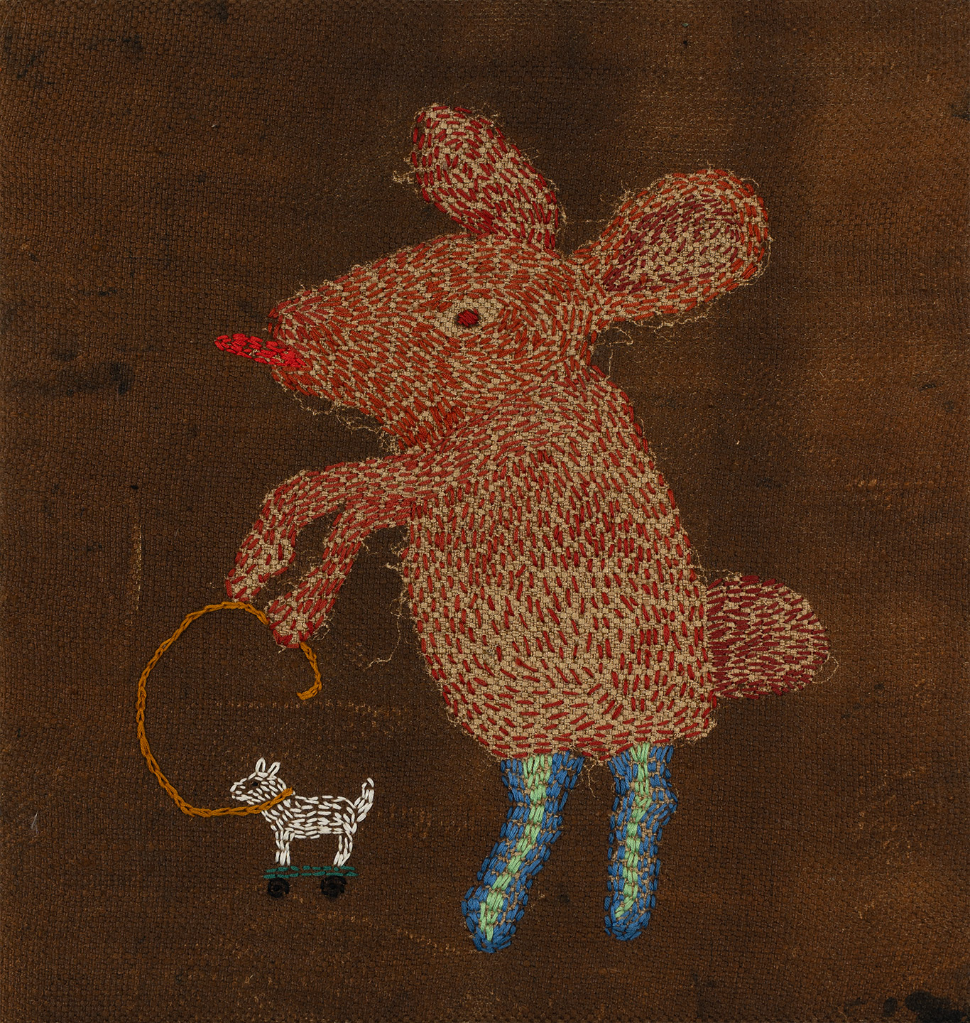 Embroidered image of imaginary animal with to animal by artist Gerda van Leeuwen.