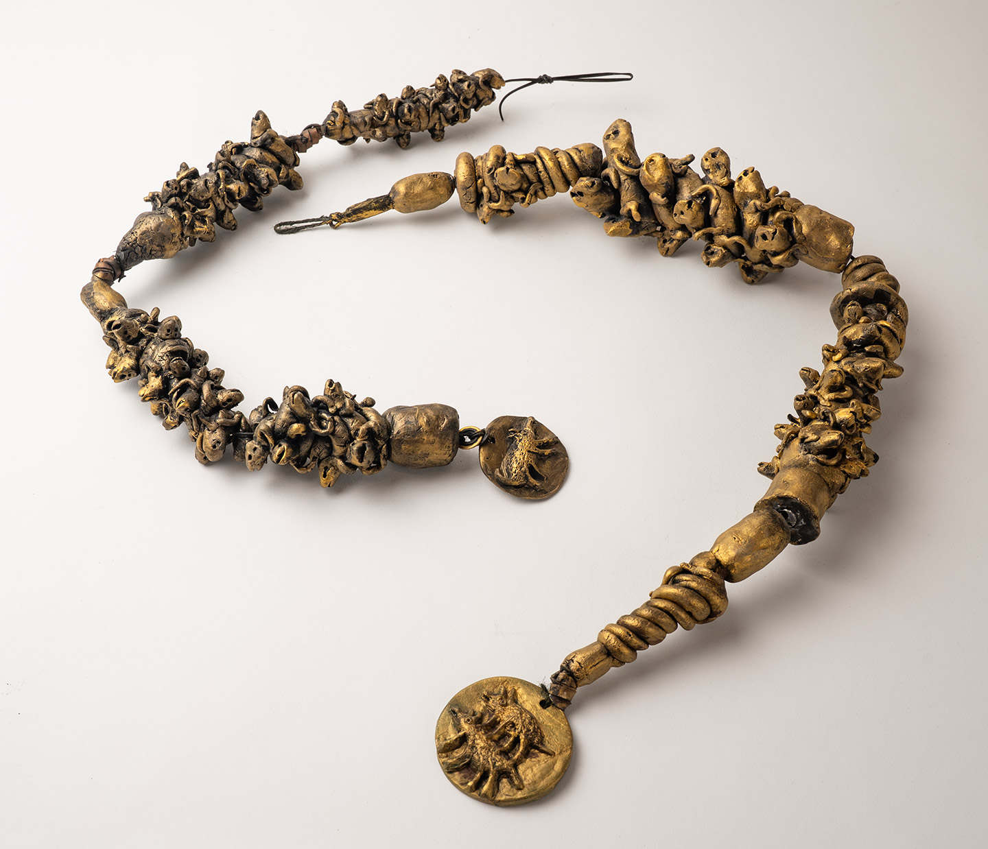 Gold ceramic assembly by artist, Gerda van Leeuwen.