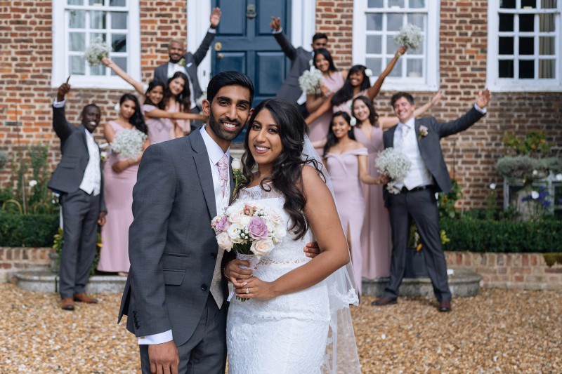 A newly married couple posing for a picture.