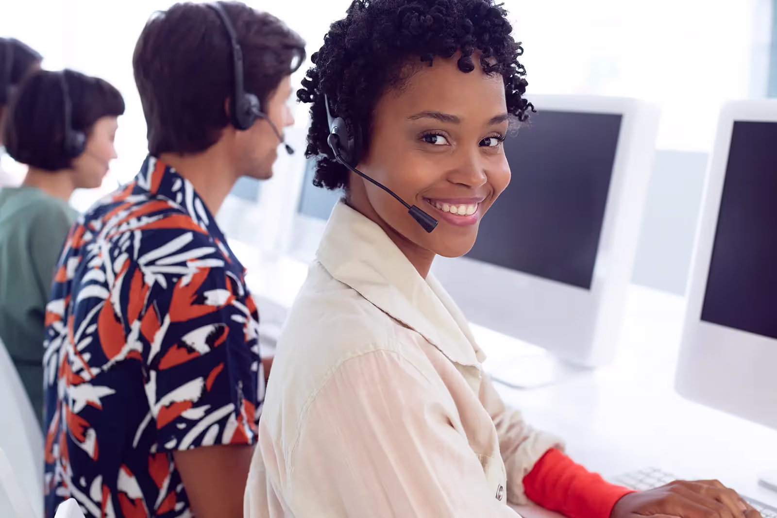 Customer care operators on the phone with their clients.