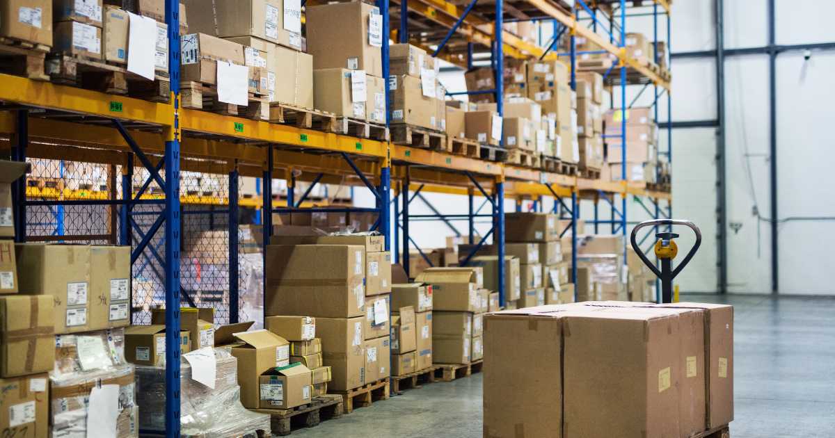 warehouse aisle with a manual forklift