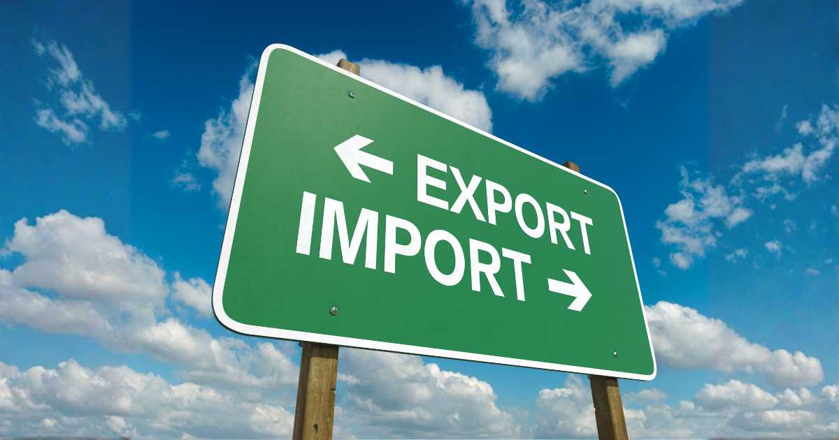 Green sign with import and export written on it