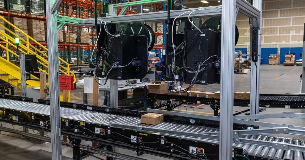 An image of a package on a conveyor belt going through a QC process check at a2b's Ogden, UT facility.