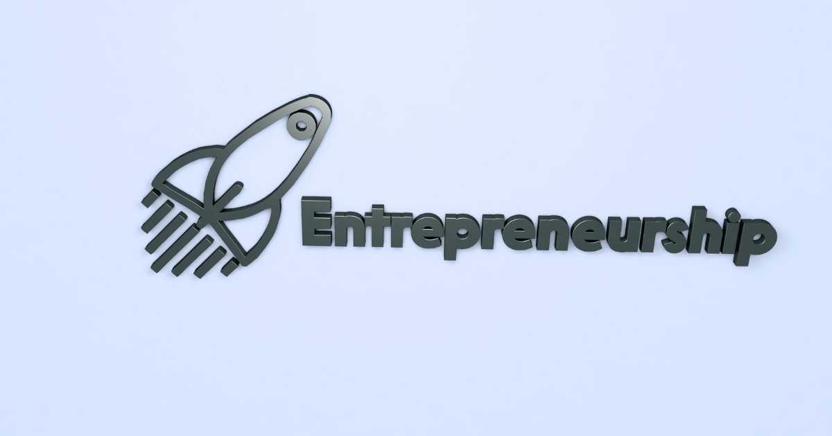 A cartoon image of a rocket ship with "Entrepreneurship" written next to it.