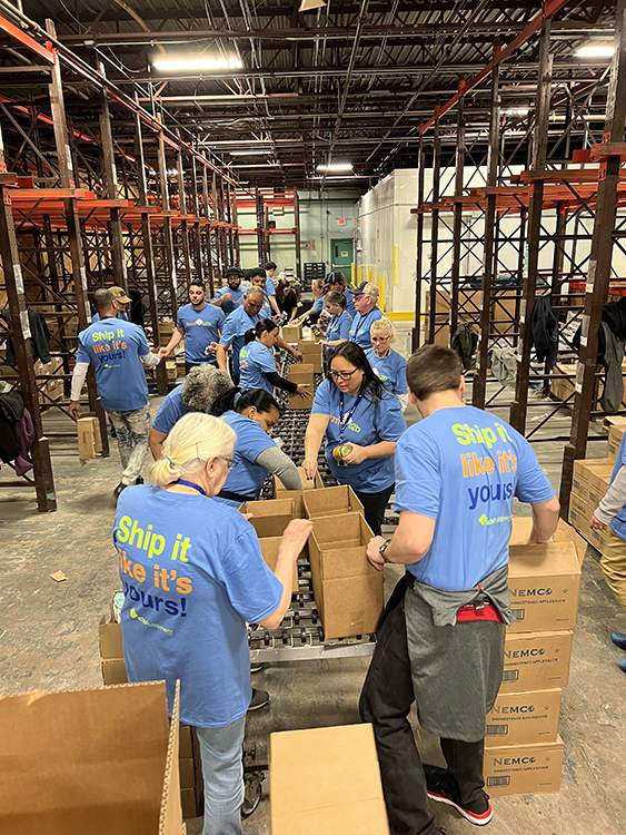 a2b Fulfillment CEO participating in a food bank line as part of the company’s community outreach efforts.