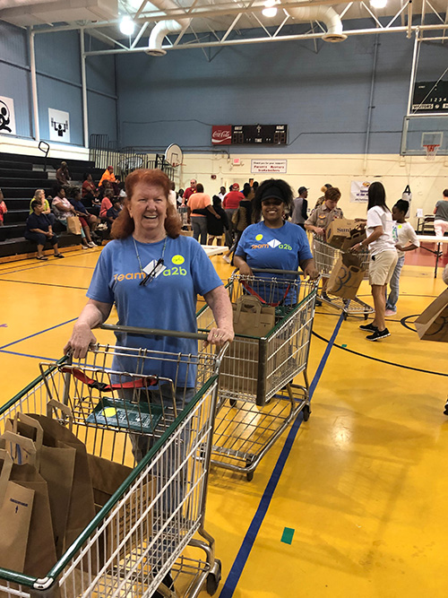 a2b Fulfillment employees volunteer at a Second Harvest food distribution event in support of the local community.