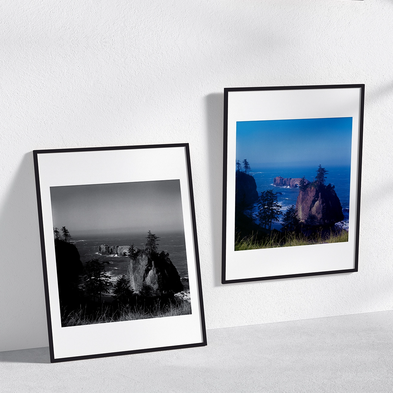 “Oregon Coast Morning” shown in two framed prints—black-and-white and color—featuring ocean sea stacks and coastal evergreens.