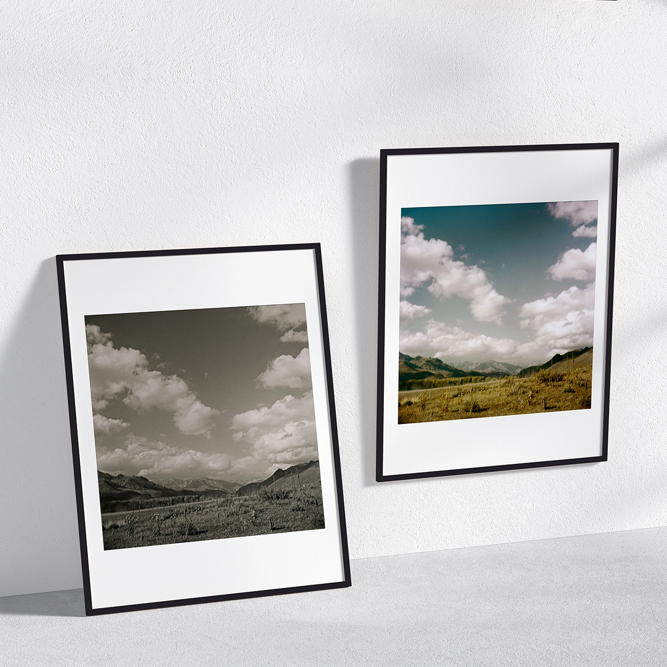 Two framed “Sun Valley 85T, Idaho” prints on a wall—one black-and-white, one color.