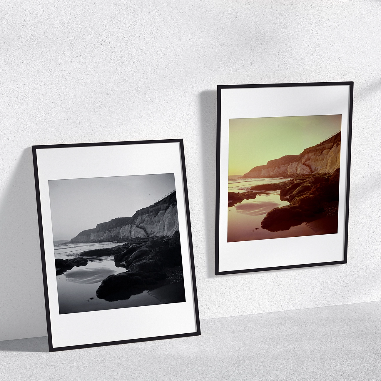 Two framed “Pismo Beach Stairs” prints side by side—black-and-white and warm-toned—showing rocky tide pools and coastal cliffs.