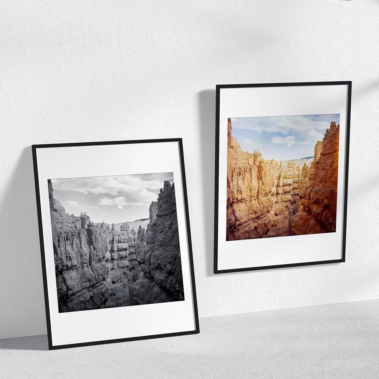 Two framed Bryce Canyon Tunnel prints shown in black-and-white and color on a minimalist wall.