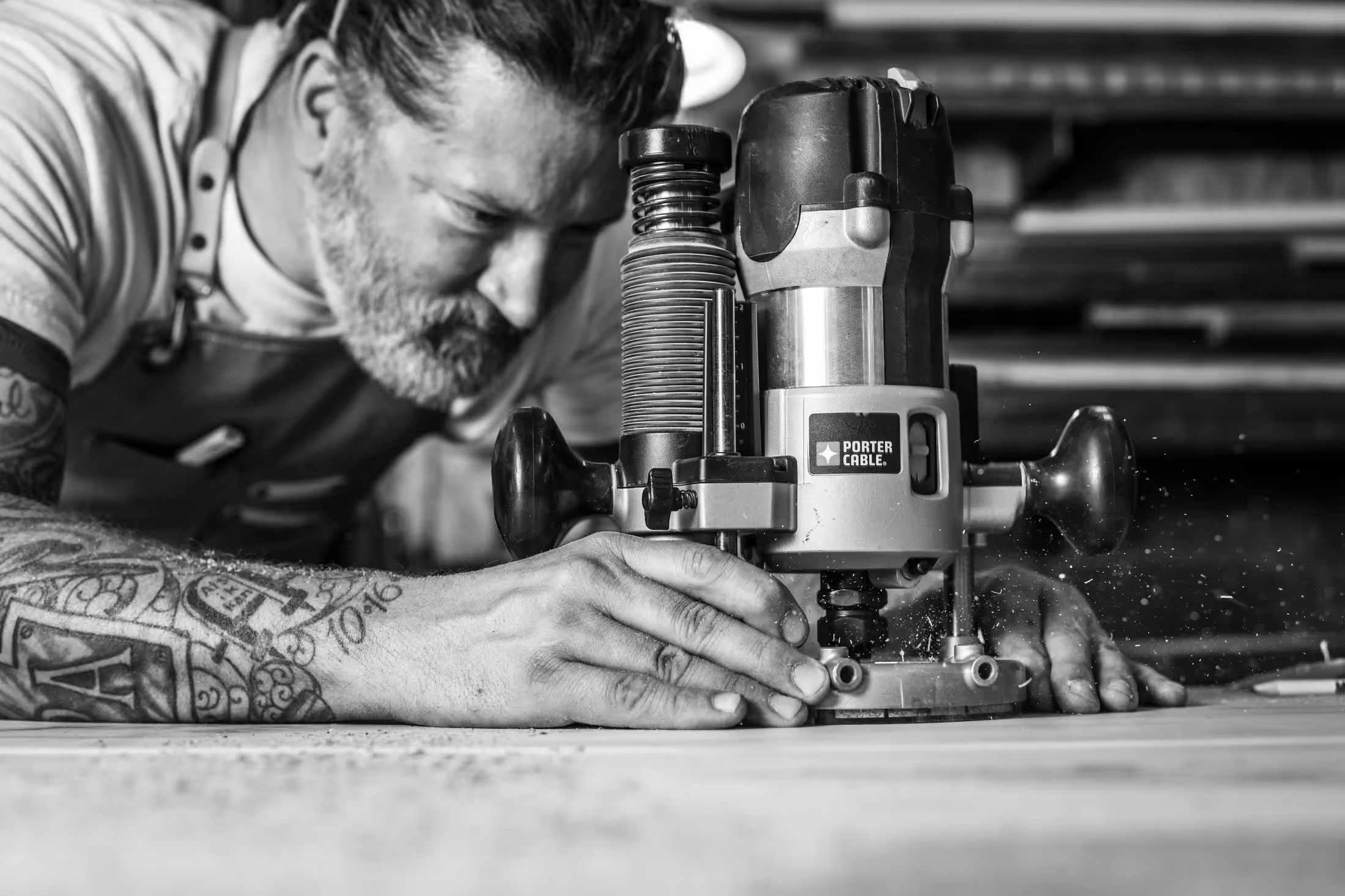 Jonathan Moran using a router in his workshop