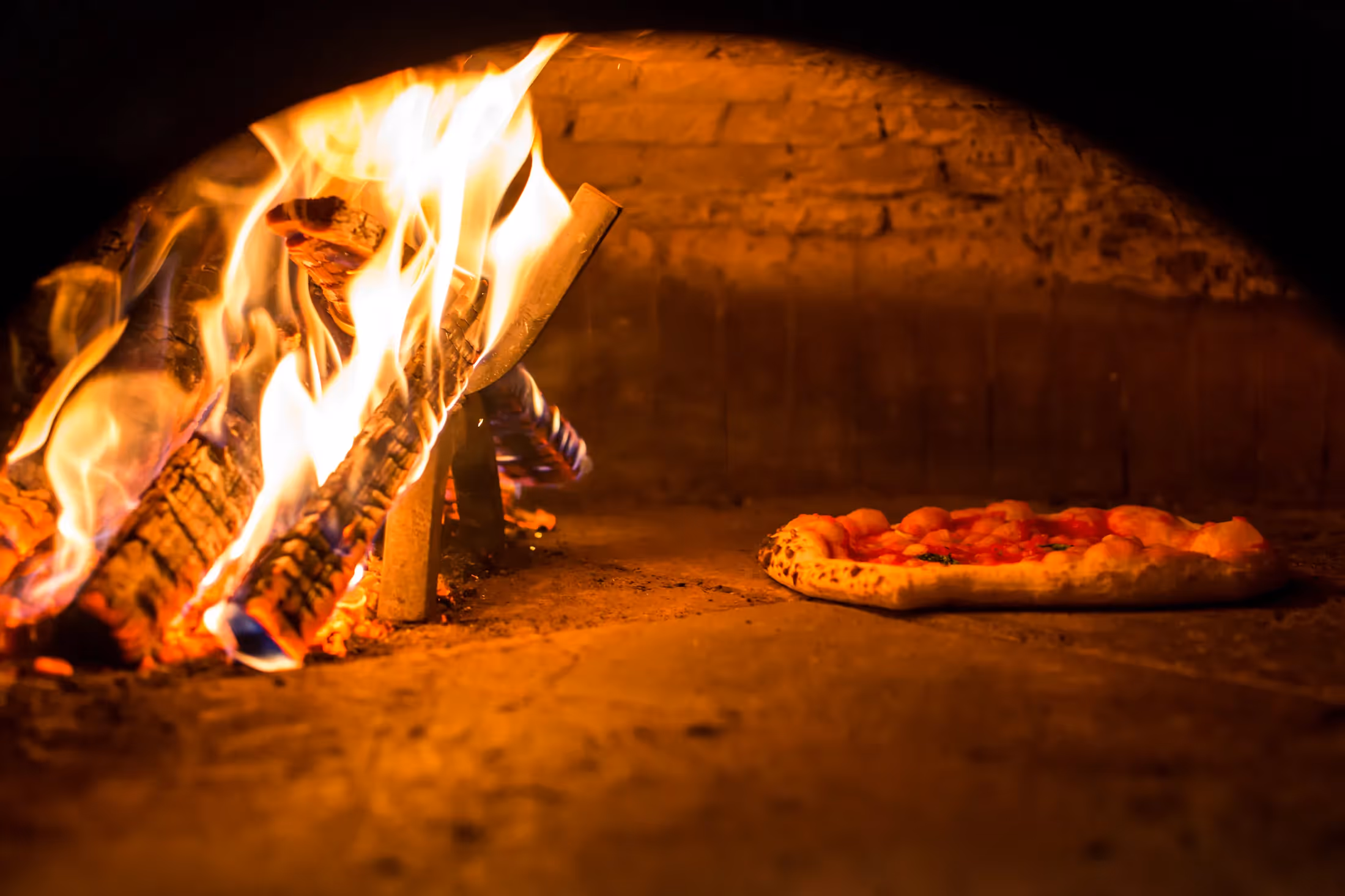 Interior of the wood fire pizza oven at Il Pizzaiolo