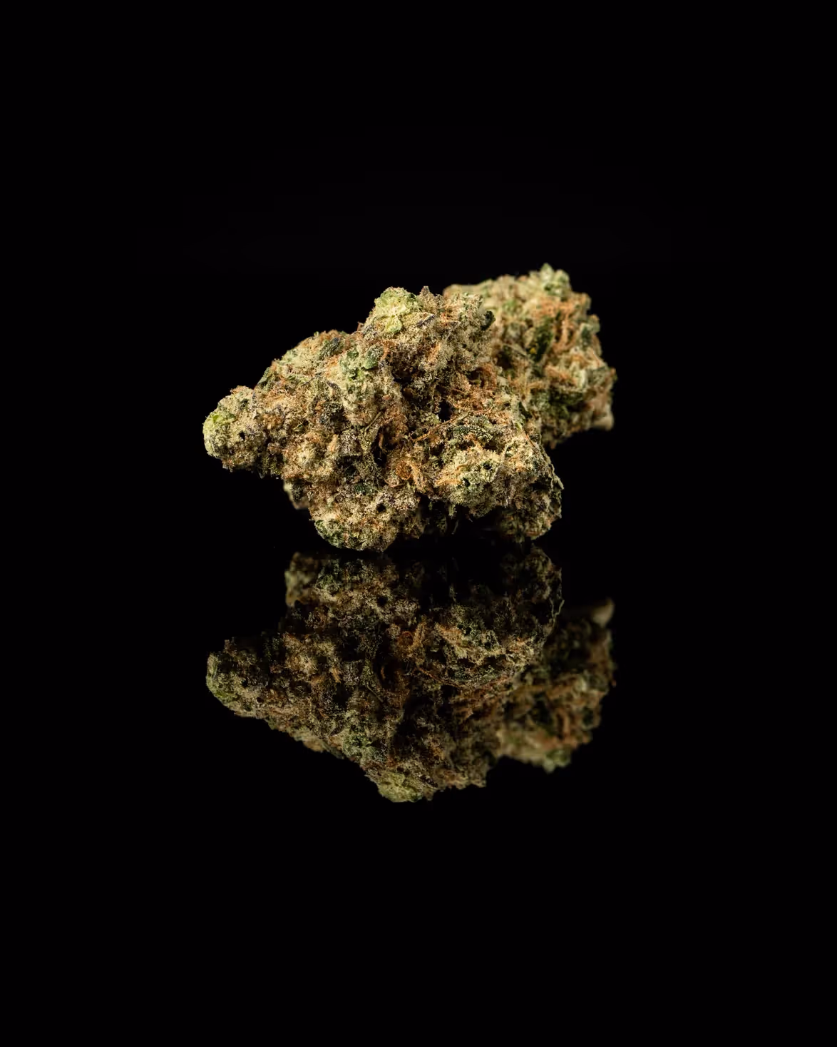 Maitri marijuana on a black reflected surface