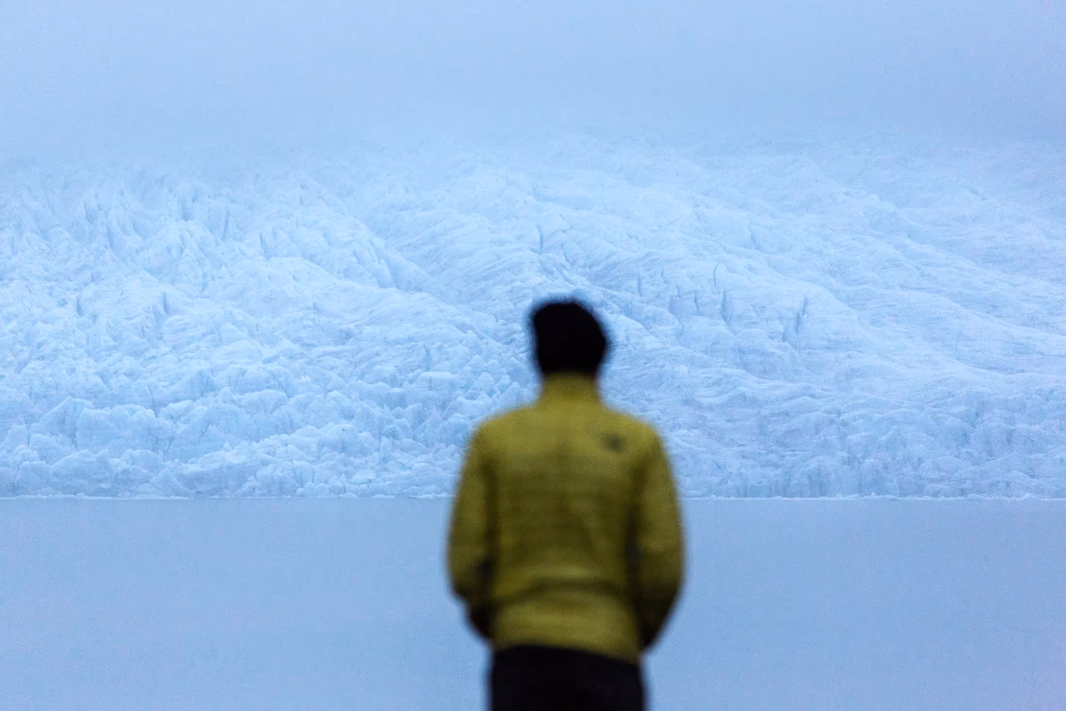 Man staring out across winter landscape in Iceland