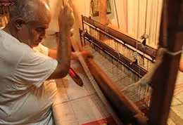 weaver working at his loom