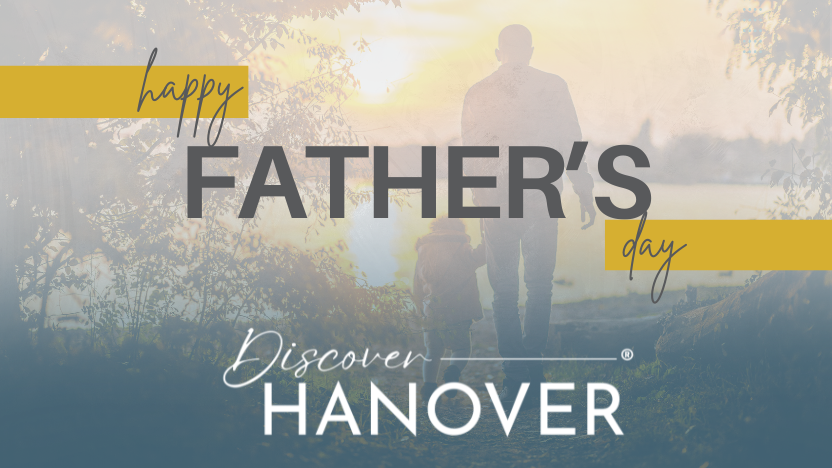 A girl and her dad walking towards a lake holding hands, with the text: "Happy Father's Day, Discover Hanover