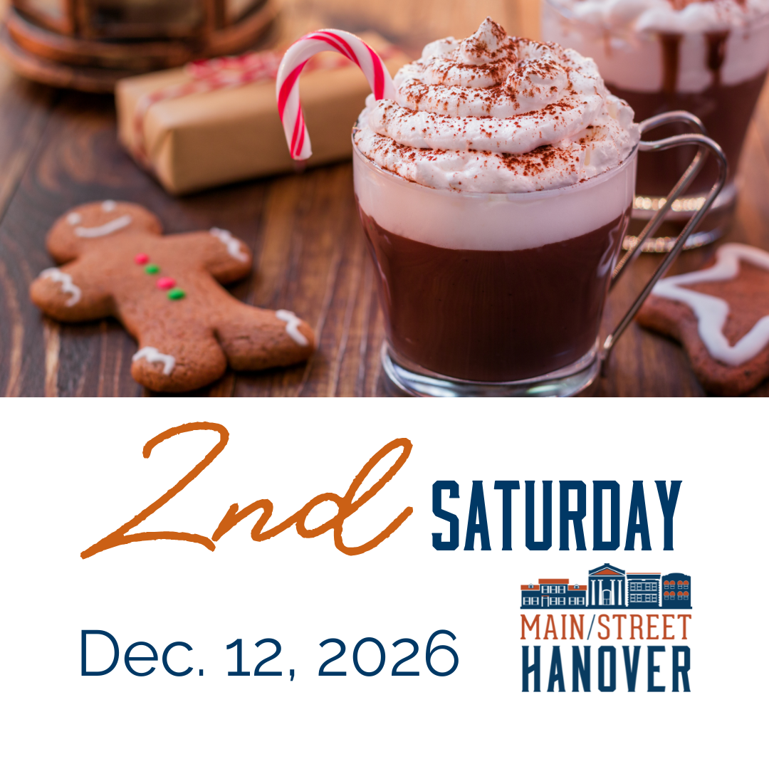 A festive picture of a cookie and hot chocolate.