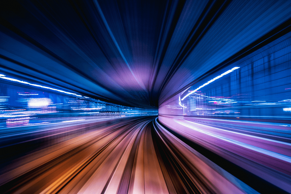 Lichttunnel mit gerichteter Bewegung nach vorn – Symbolbild für dacons Vision als Vorreiter in der Finanztechnologie