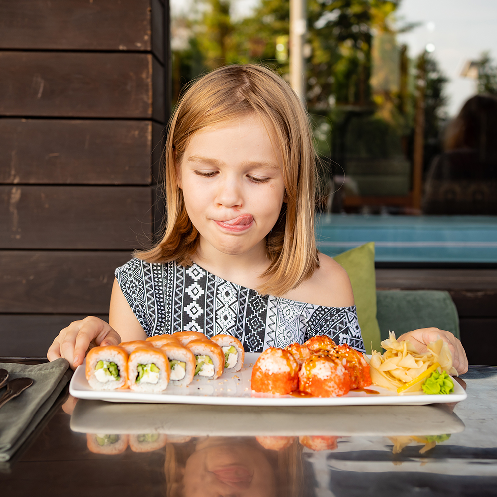 Image of a girl enjoying fresh seafood