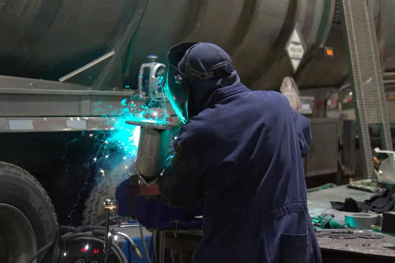 diesel tech welding a heavy duty truck