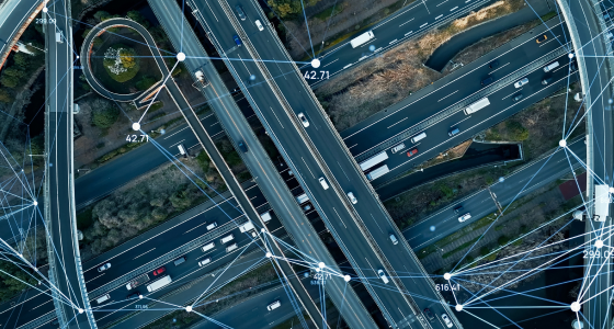 Aerial view of a highway junction with network overlay