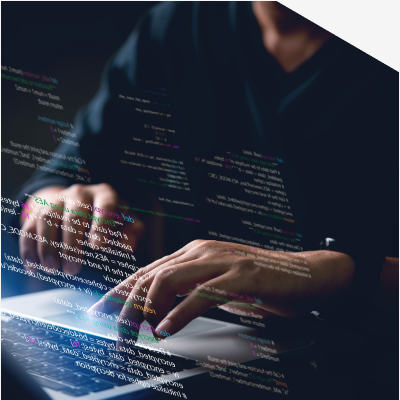 Hands typing on a laptop with data overlay