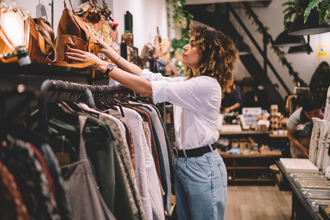 Shopper browsing clothing in a retail store